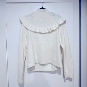 Soft & cozy cream sweater with beautiful detailing.